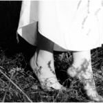 a woman's bare feet in a field of grass